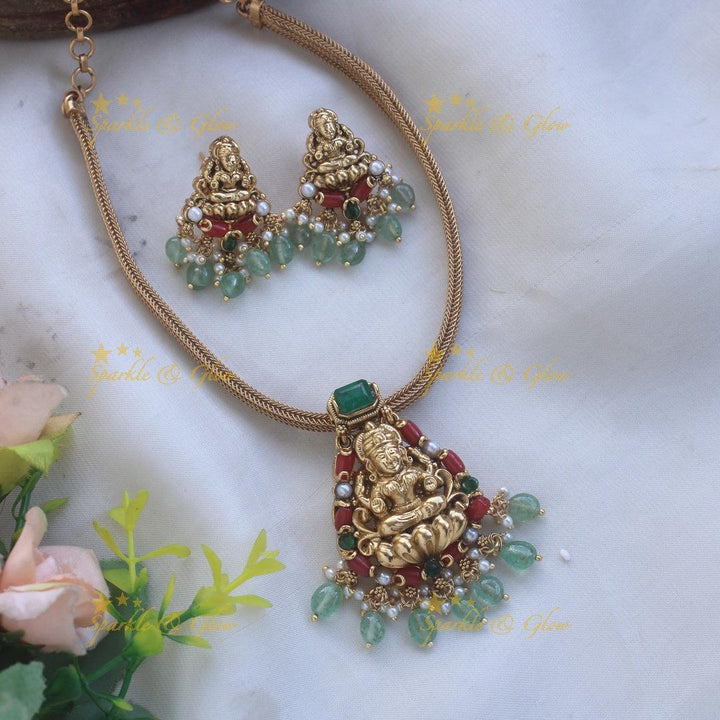 Beautiful Lakshmi carved pendant Chain with coral emerald and mint green beads - Sparkle and Glow