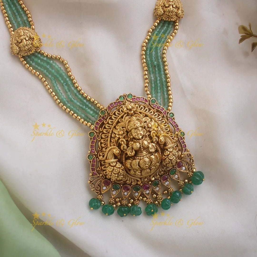 Stunning Lakshmi Peacock carved pendant haram with multi layered Mintgreen and Gold beads chain - Sparkle and Glow