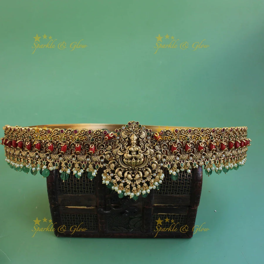 Grand intricate Lakshmi Peacock carved hipbelt with coral pearls and green beads - Sparkle and Glow