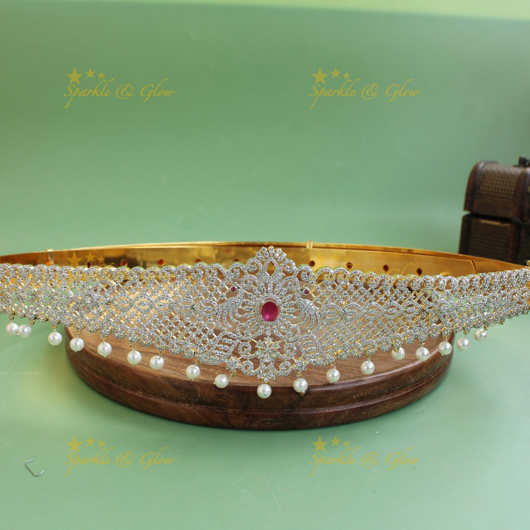 Sparkling Peacock and leaf design American diamond hipbelt with ruby and pearl drops