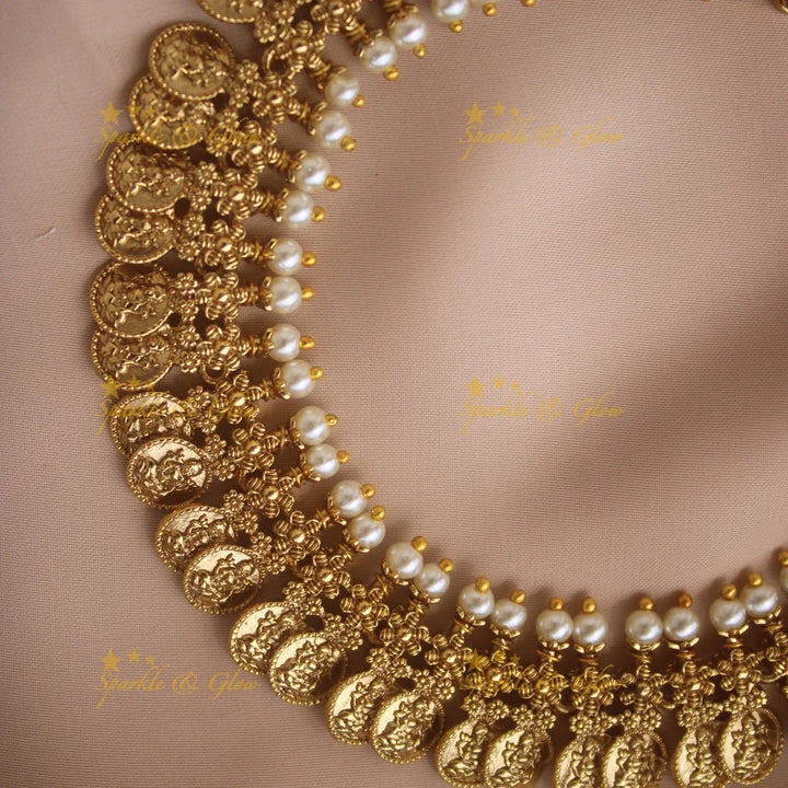 Gold alike Lakshmi coin and floral design AD short necklace with ruby emerald and pearls - Sparkle and Glow