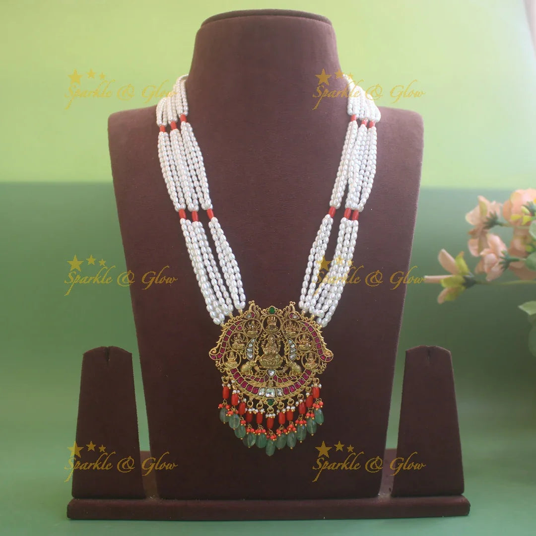 Exquisite Lakshmi Elephant Peacock carved pendant haram with coral multi layer pearl chain and mint green beads - Sparkle and Glow