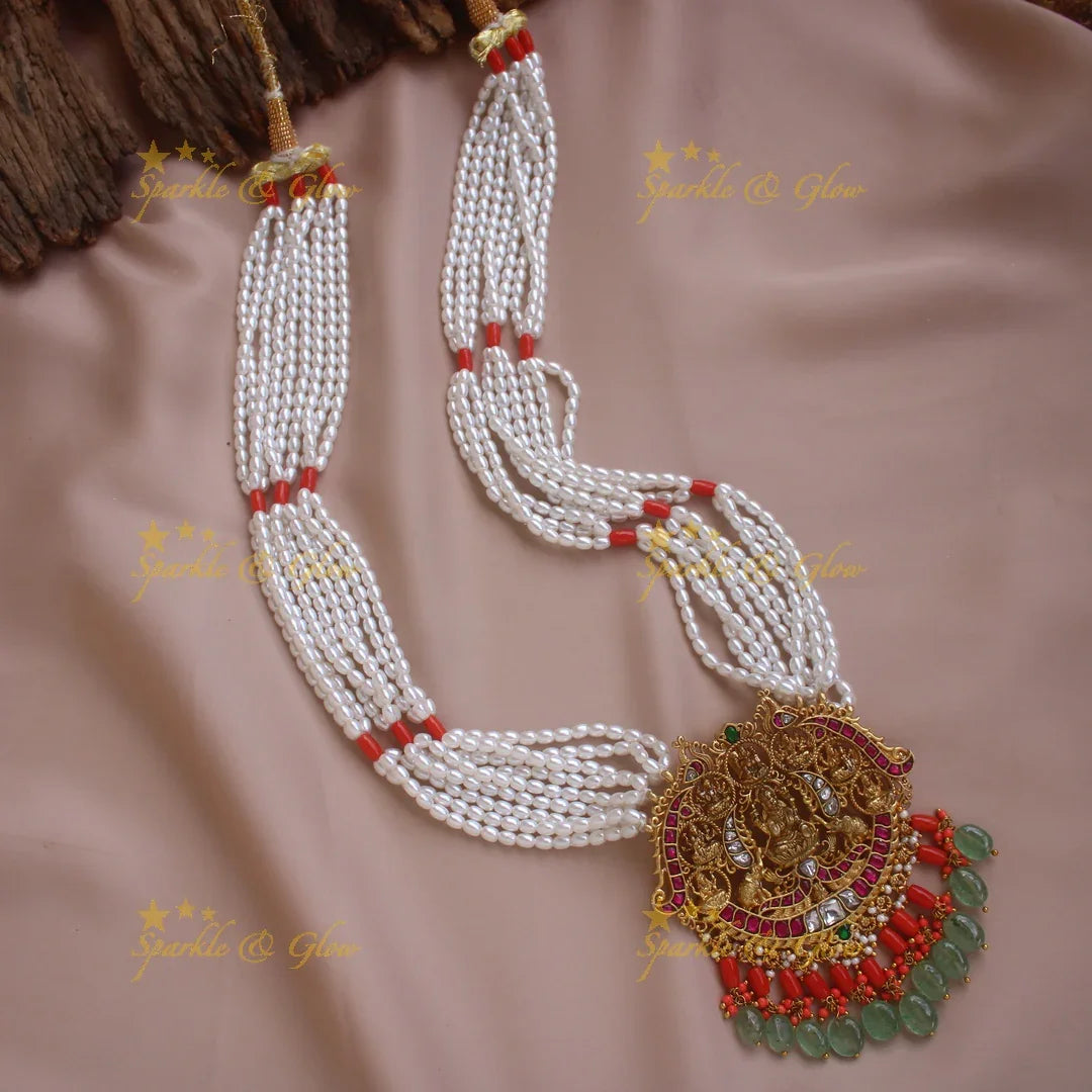 Exquisite Lakshmi Elephant Peacock carved pendant haram with coral multi layer pearl chain and mint green beads - Sparkle and Glow