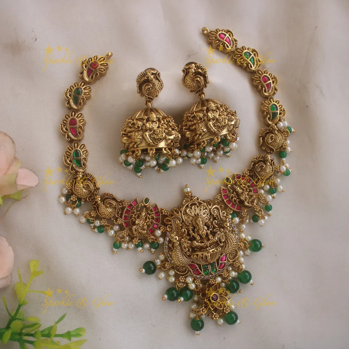 Gorgeous Lakshmi peacock carved jadau short necklace with pearls and green beads - Sparkle and Glow