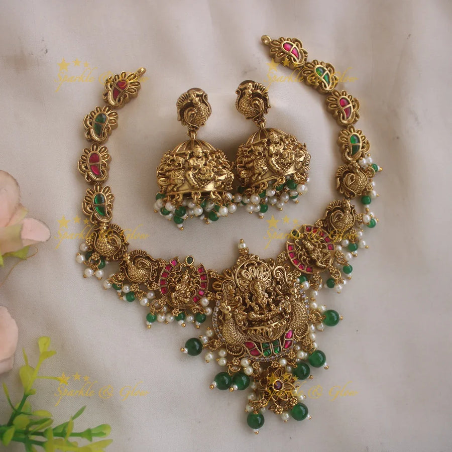 Gorgeous Lakshmi peacock carved jadau short necklace with pearls and green beads - Sparkle and Glow