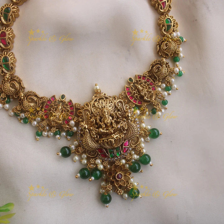 Gorgeous Lakshmi peacock carved jadau short necklace with pearls and green beads - Sparkle and Glow