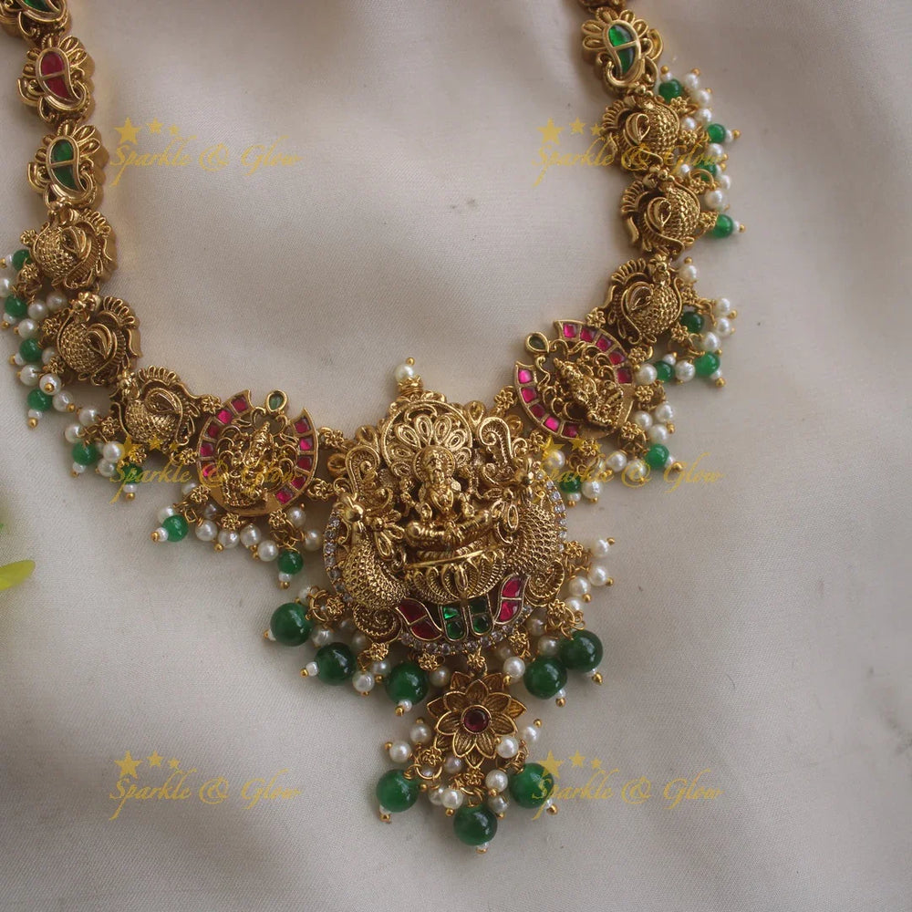 Gorgeous Lakshmi peacock carved jadau long necklace with pearls and green beads - Sparkle and Glow
