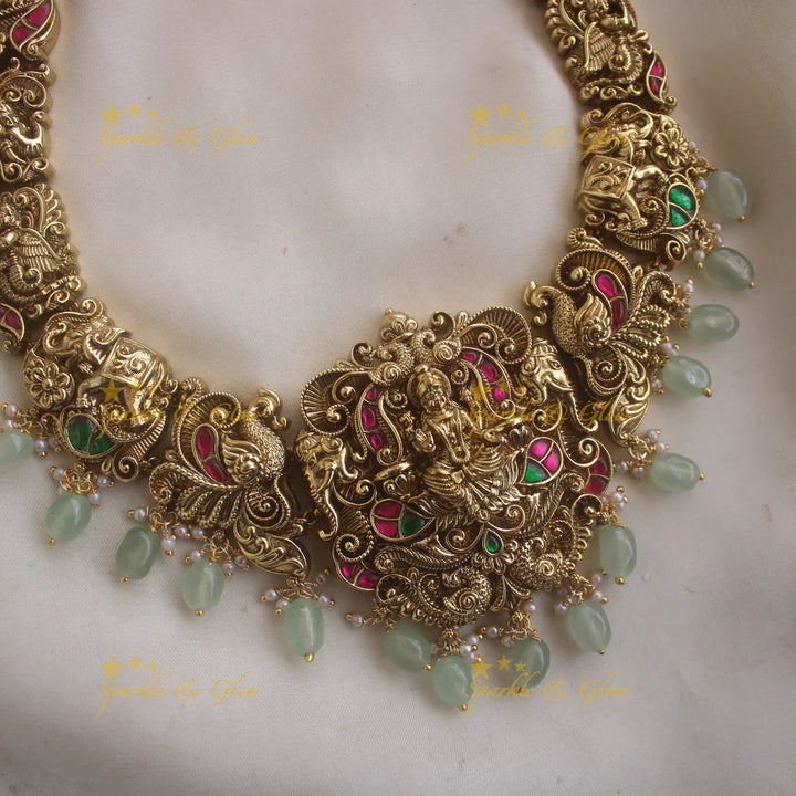 Exclusive Lakshmi peacock elephant carved jadau long necklace with pearls and mint green beads - Sparkle and Glow