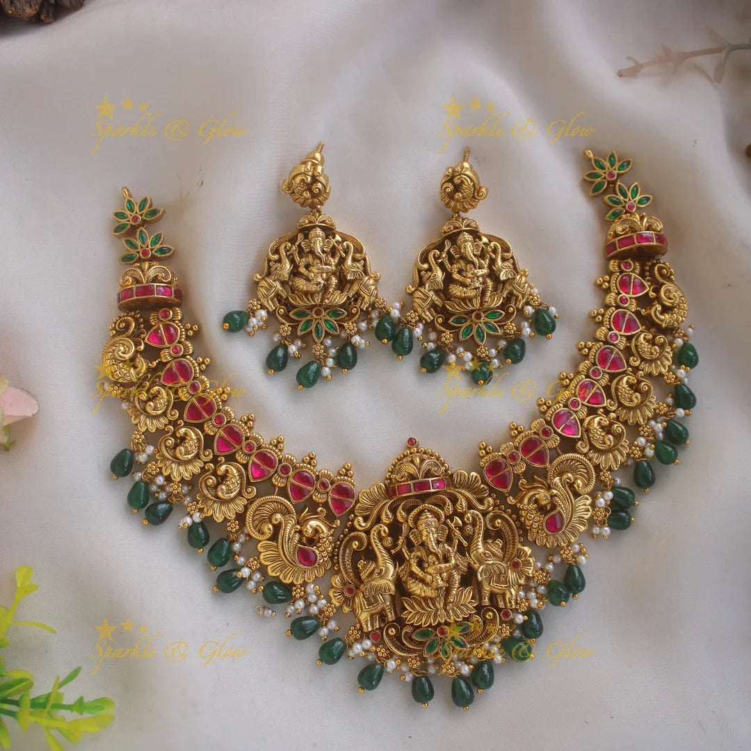 Beautiful Ganesha peacock elephant carved jadau short necklace with pearls and green beads - Sparkle and Glow