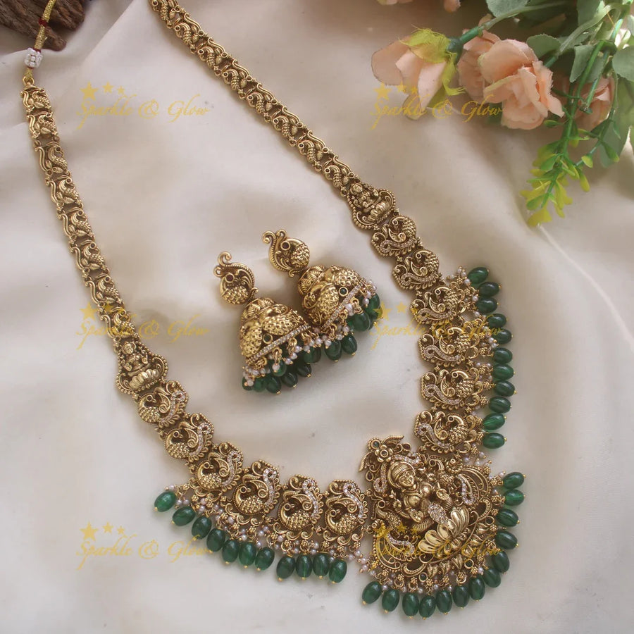 Stunning Lakshmi Peacock carved long necklace with CZ stones and green beads - Sparkle and Glow