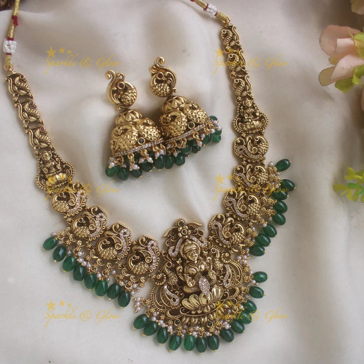 Elegant Lakshmi Peacock carved short necklace with CZ stones and green beads - Sparkle and Glow