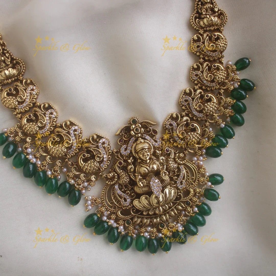 Elegant Lakshmi Peacock carved short necklace with CZ stones and green beads - Sparkle and Glow