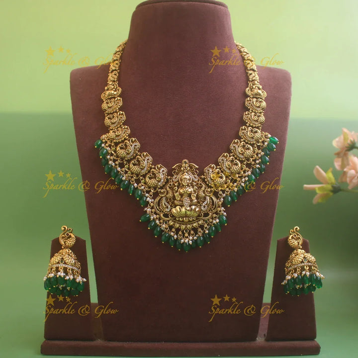 Elegant Lakshmi Peacock carved short necklace with CZ stones and green beads - Sparkle and Glow