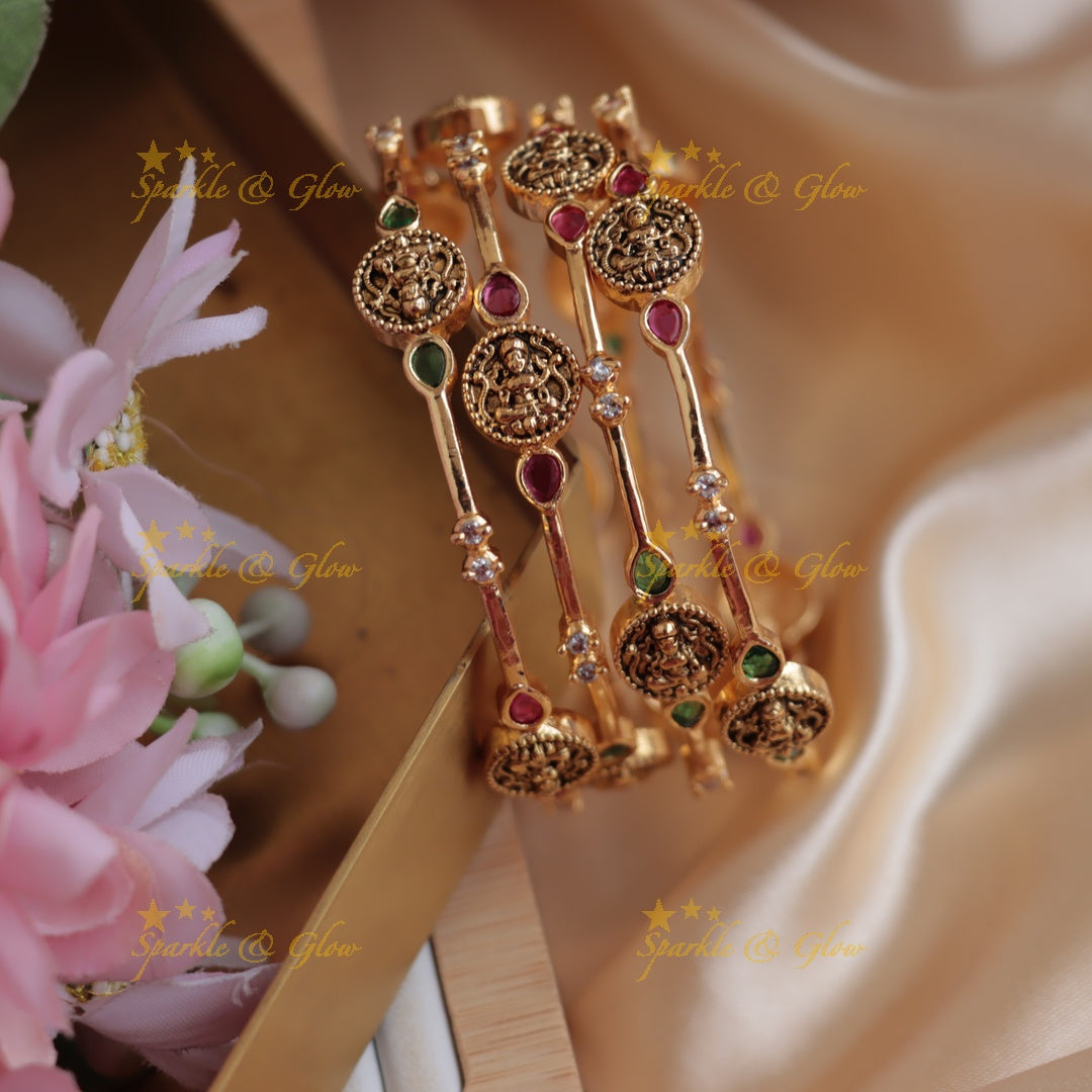 Elegant Lakshmi carved bangles with ruby emerald and white stones, two pairs , 2.4