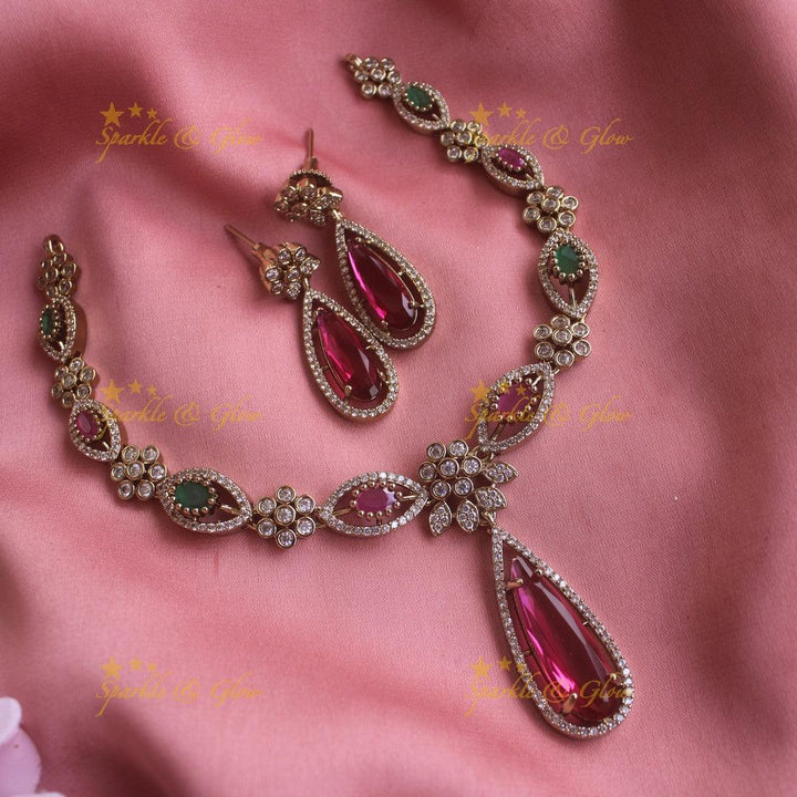 Statement Floral and oval stone drop AD short necklace with ruby and emeralds - Sparkle and Glow