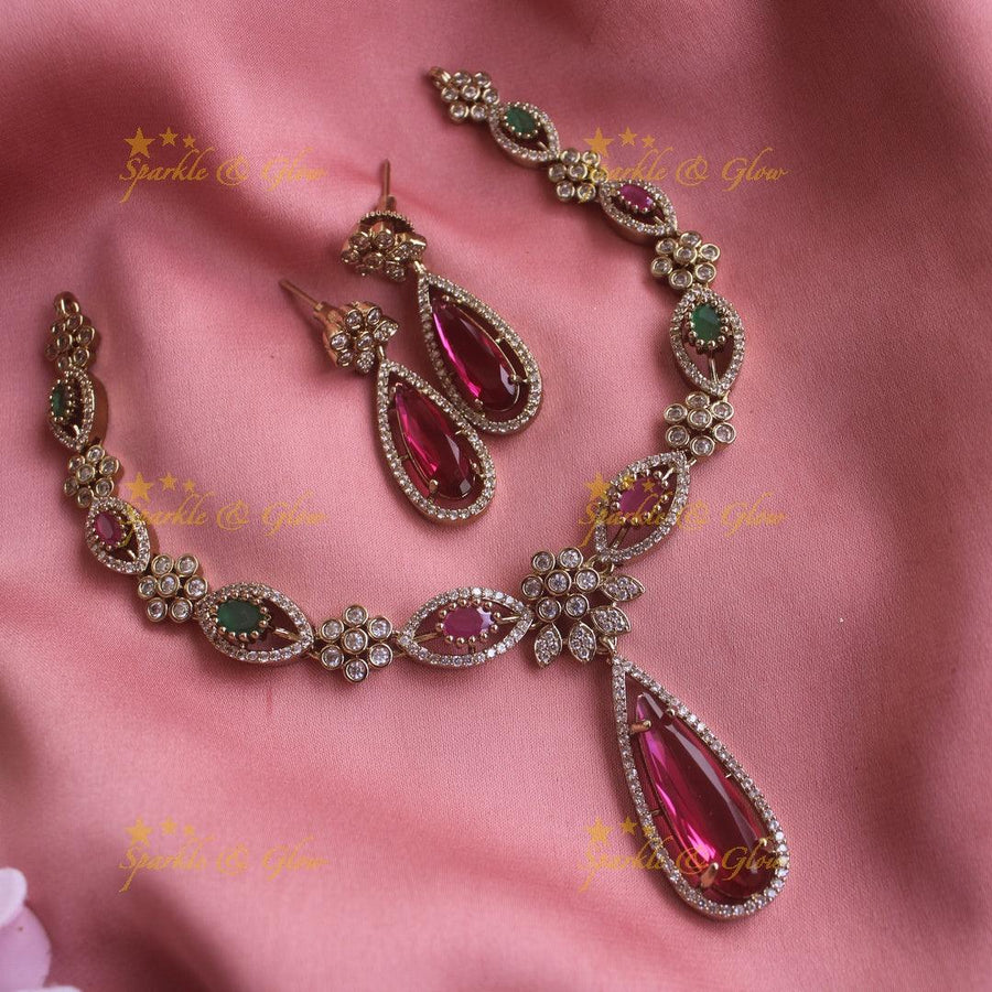 Statement Floral and oval stone drop AD short necklace with ruby and emeralds - Sparkle and Glow