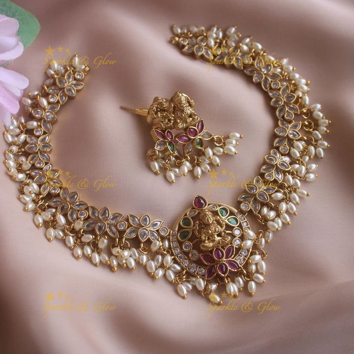 Statement Lakshmi lotus design short necklace with ruby emerald CZ stones and rice pearls - Sparkle and Glow