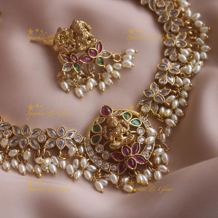 Statement Lakshmi lotus design short necklace with ruby emerald CZ stones and rice pearls - Sparkle and Glow