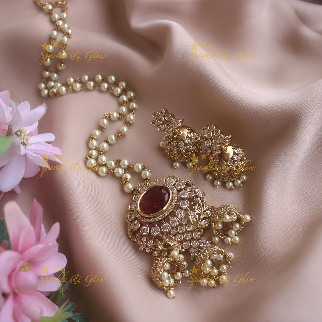 Elegant Floral and ruby stone pendant haram with pearl chain and jhumuka drops - Sparkle and Glow