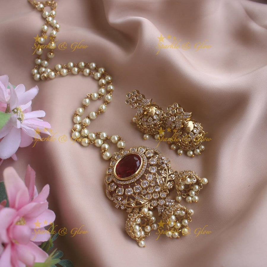 Elegant Floral and ruby stone pendant haram with pearl chain and jhumuka drops - Sparkle and Glow