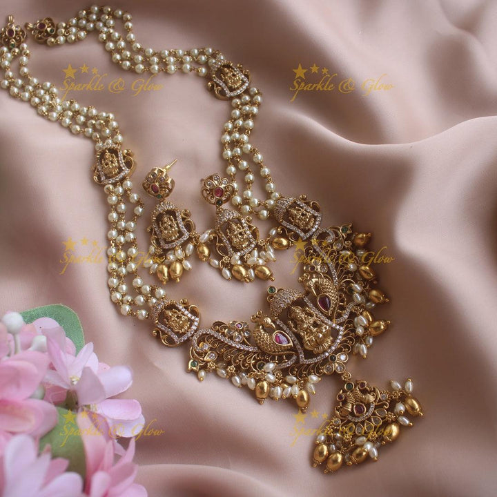 Gorgeous Lakshmi peacock pendant haram with multi layer pearl chain CZ stones and gold beads - Sparkle and Glow
