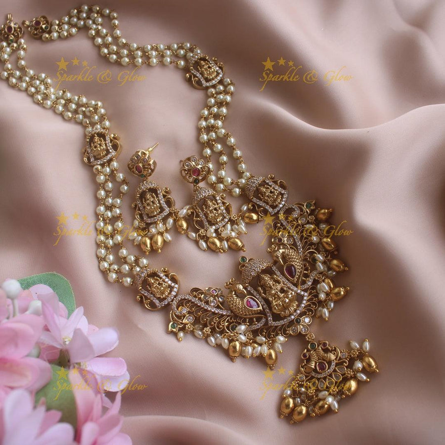 Gorgeous Lakshmi peacock pendant haram with multi layer pearl chain CZ stones and gold beads - Sparkle and Glow