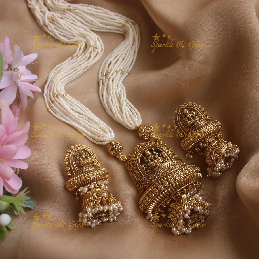 Statement Lakshmi floral pendant haram with multi layer pearl chain and gold beads - Sparkle and Glow