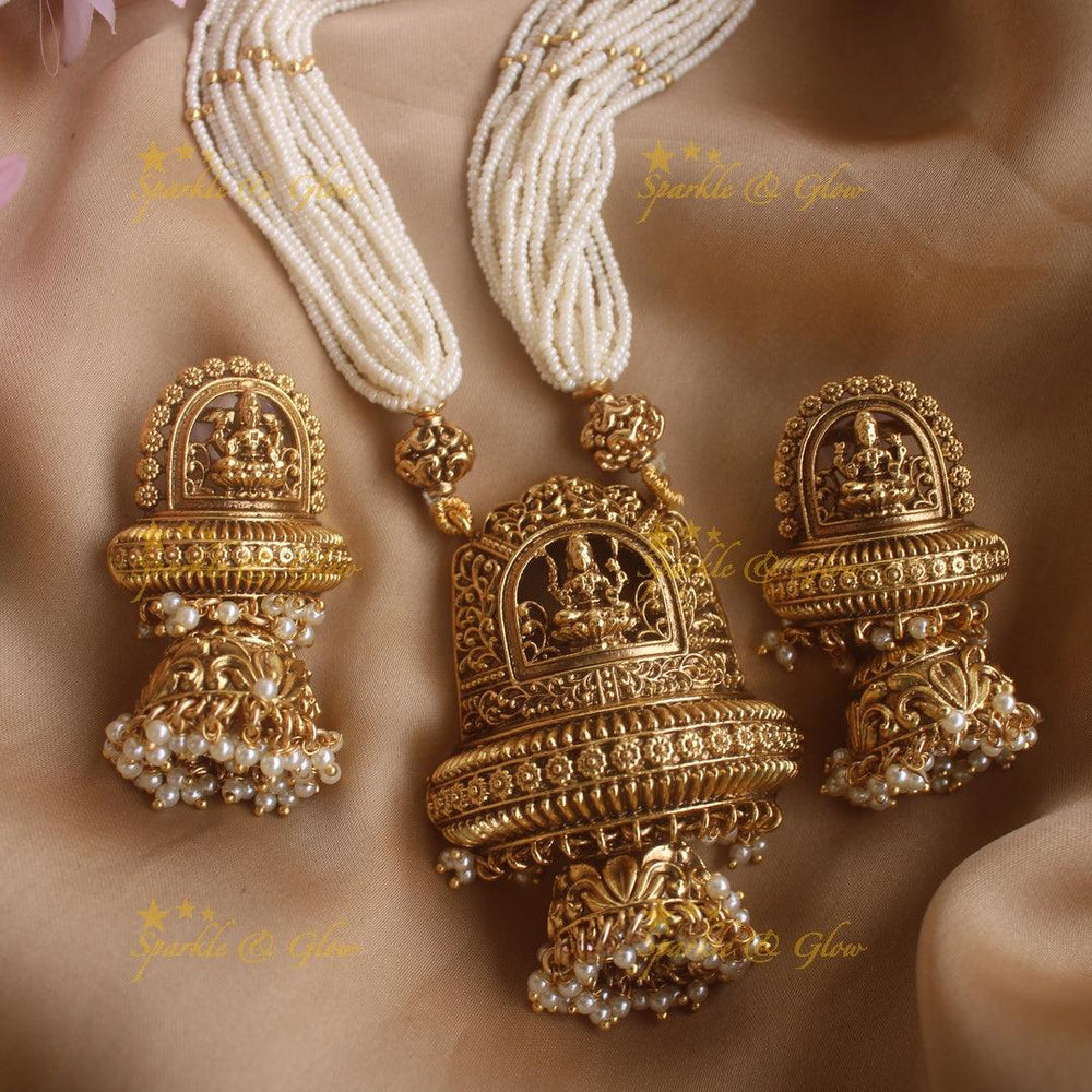 Statement Lakshmi floral pendant haram with multi layer pearl chain and gold beads - Sparkle and Glow