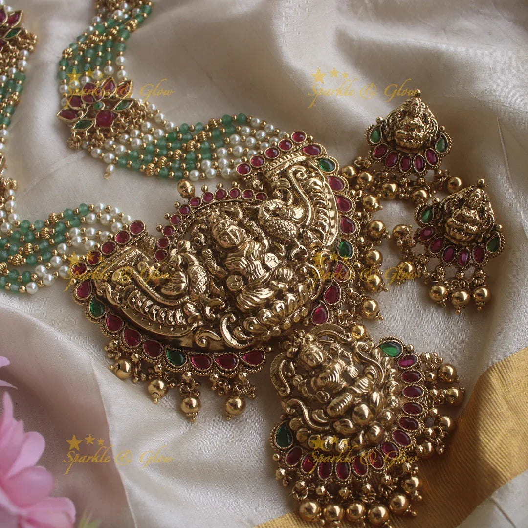 Stunning Lakshmi pendant lotus design haram with multi layer pearl and mint green beads chain - Sparkle and Glow