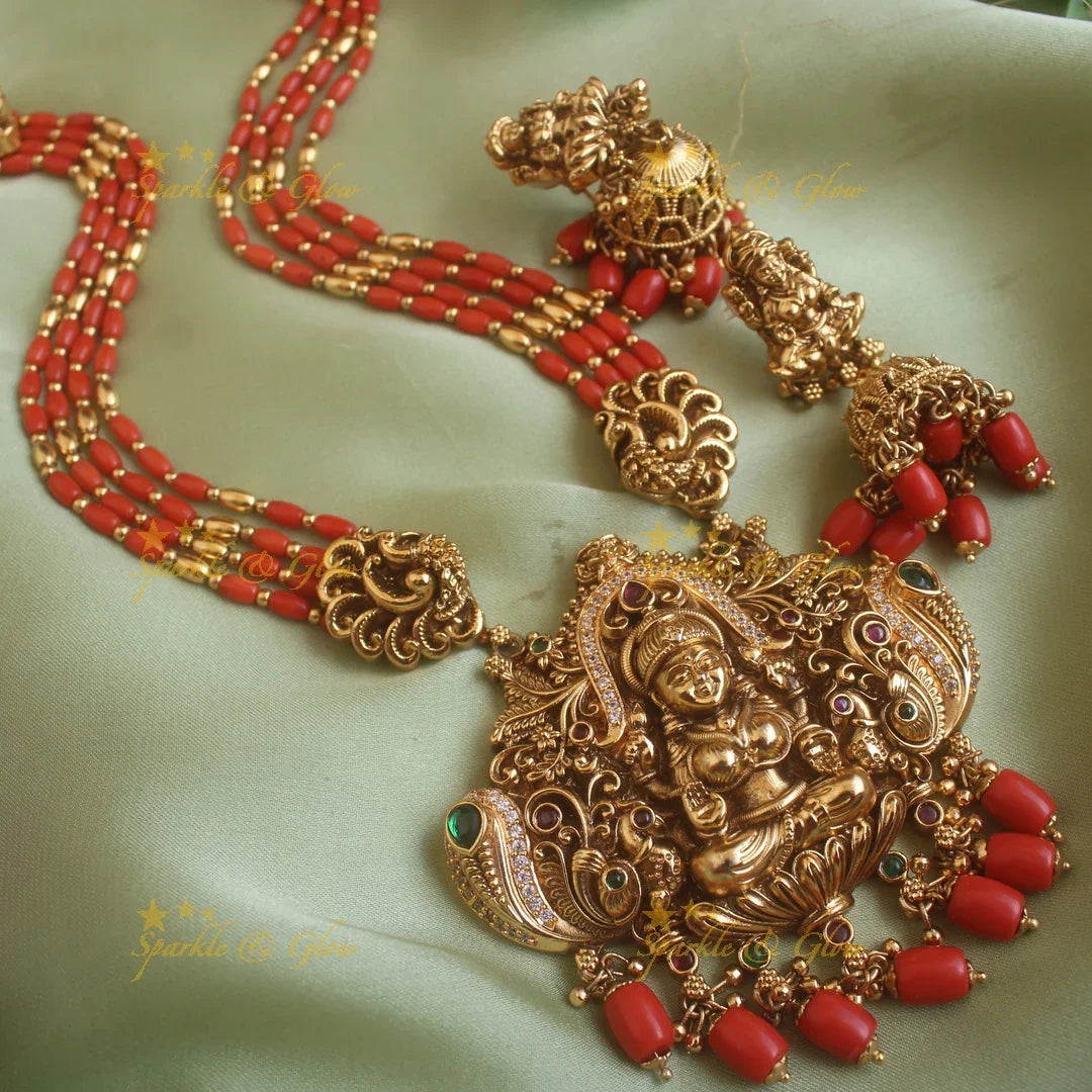Gorgeous Lakshmi peacock carved pendant haram with multi layer gold and coral beads chain and stones - Sparkle and Glow