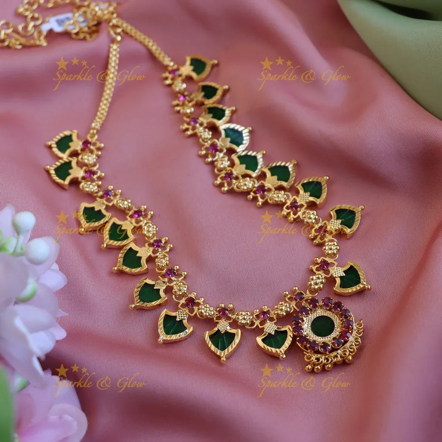 Elegant Leaf shape green palakka kerala style short necklace with ruby stones and gold beads - Sparkle and Glow