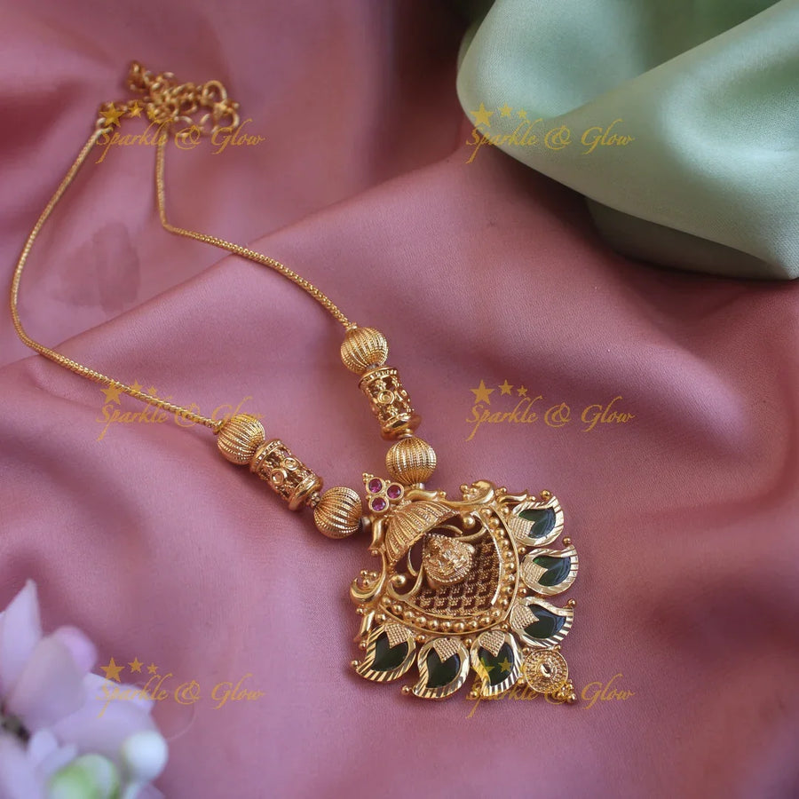 Elegant Mango Lakshmi Carved pendent with gold chain - Sparkle and Glow