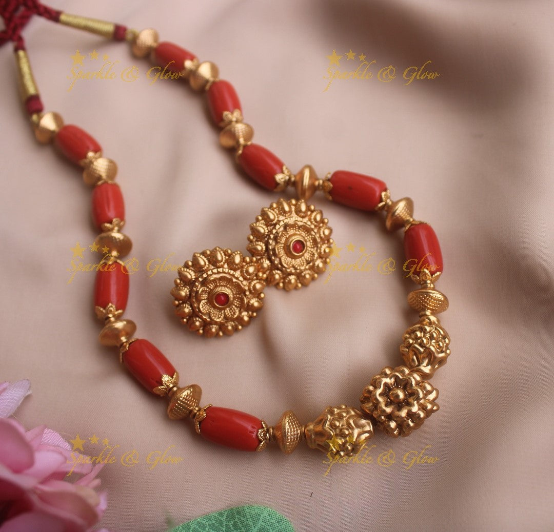 Intricately caved Coral and Gold beaded short necklace