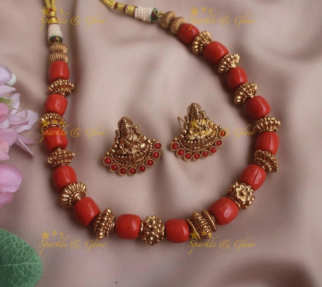 Heavy look Coral beaded short necklace with lakshmi earrings - Sparkle and Glow