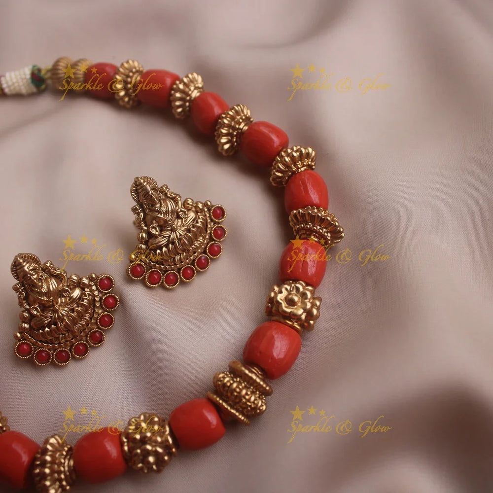 Heavy look Coral beaded short necklace with lakshmi earrings - Sparkle and Glow
