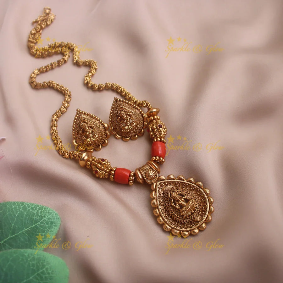 Idol Lakshmi pendant carved coral and gold ball beaded chain - Sparkle and Glow