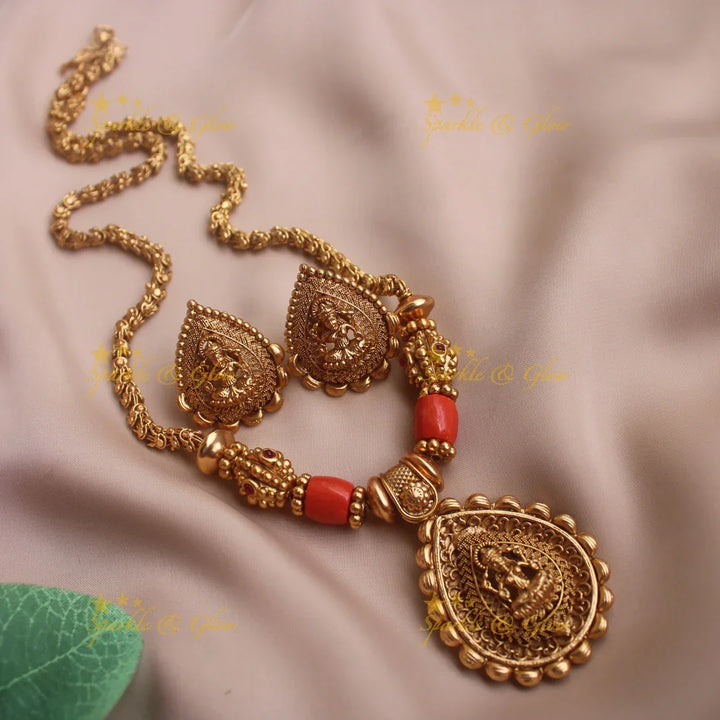 Idol Lakshmi pendant carved coral and gold ball beaded chain - Sparkle and Glow