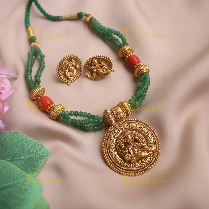 Idol Ganesha pendant Emerald crystal layered necklace with coral beads - Sparkle and Glow