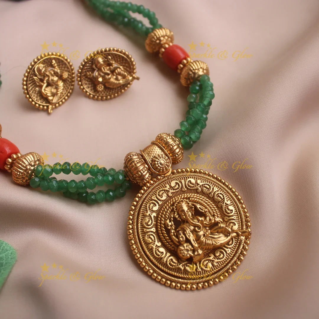 Idol Ganesha pendant Emerald crystal layered necklace with coral beads - Sparkle and Glow