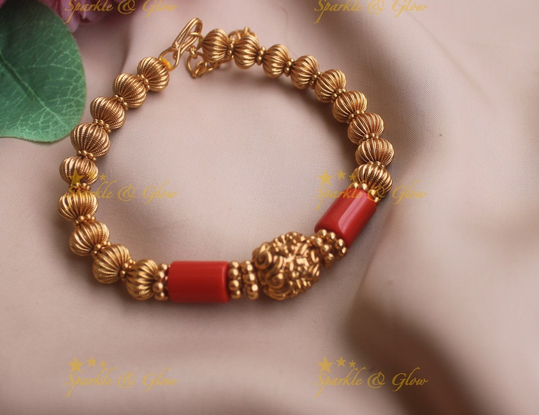 Elegant Gold and coral beaded bracelet