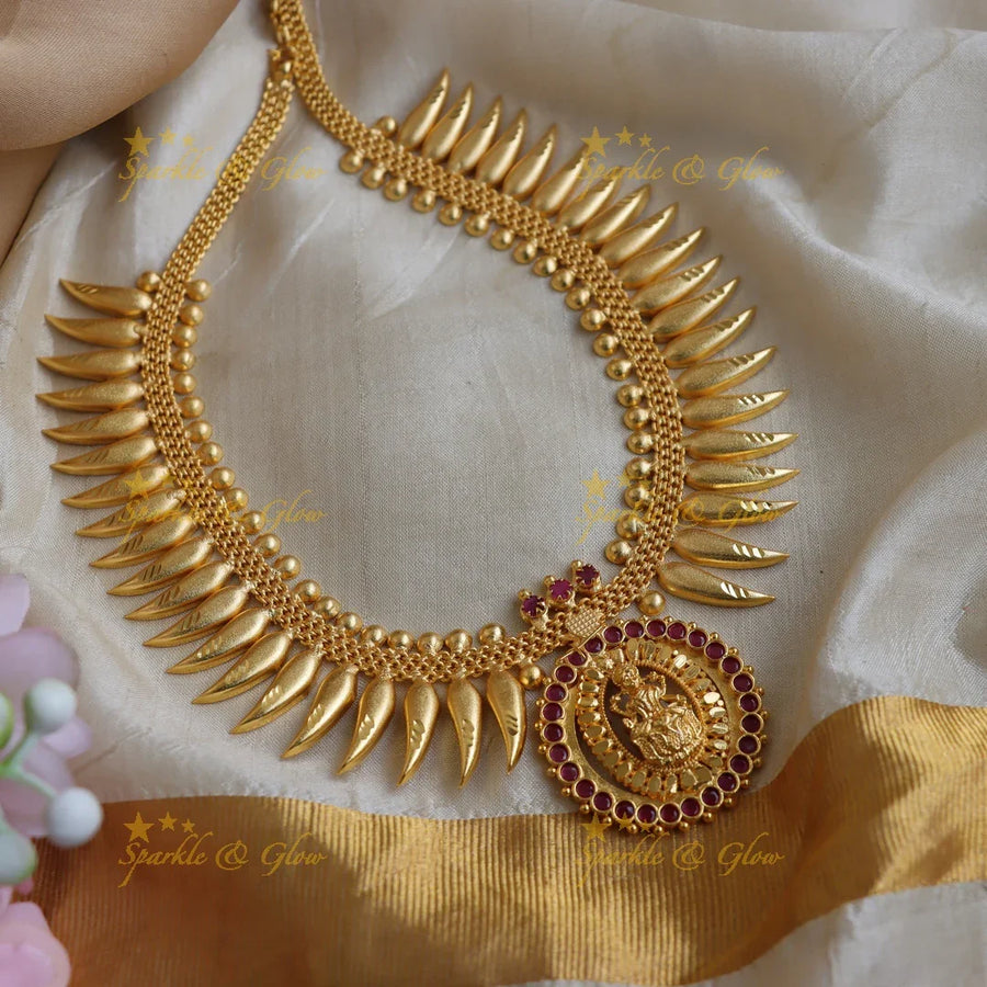 Beautiful Lakshmi pendant spike kerala style short necklace with ruby stones and gold beads - Sparkle and Glow