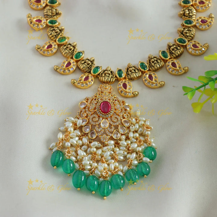 Elegant Lakshmi mango design AD short necklace with ruby emerald rice pearls and green beads - Sparkle and Glow