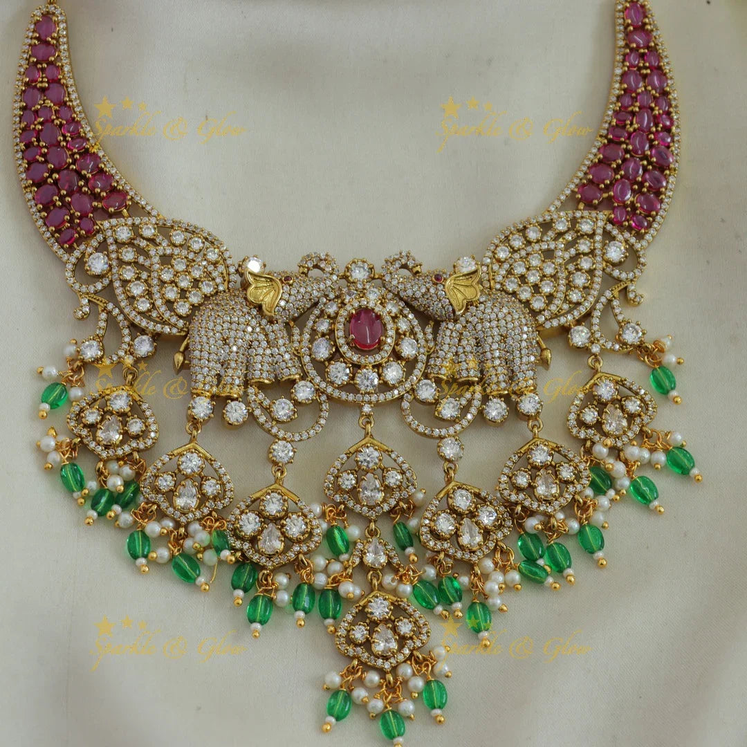 Beautiful Elephant and leaf design AD short necklace with ruby pearls and green beads - Sparkle and Glow