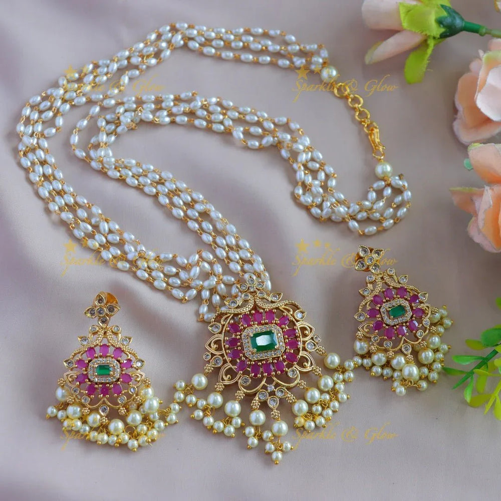 Gorgeous Floral peacock pendant haram with multi layer rice pearl chain and ruby emerald - pink - Sparkle and Glow