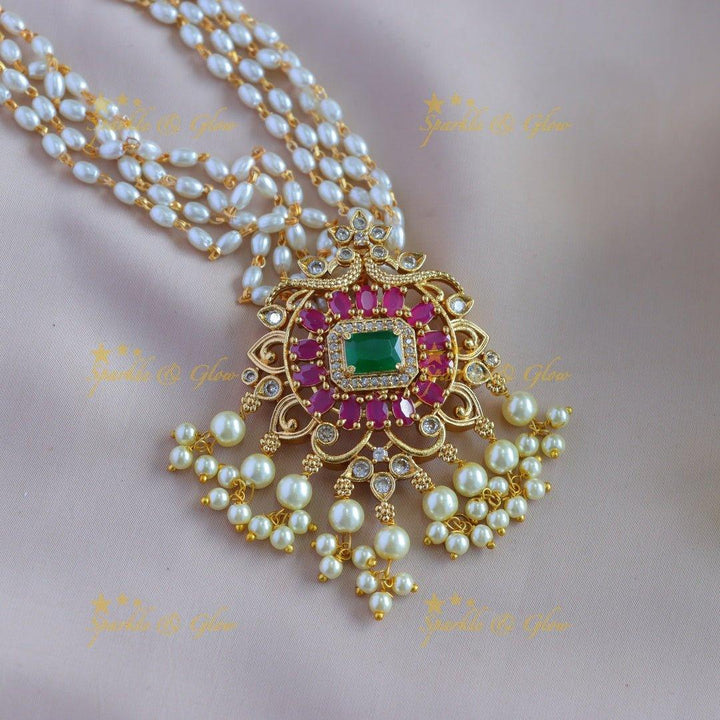 Gorgeous Floral peacock pendant haram with multi layer rice pearl chain and ruby emerald - pink - Sparkle and Glow