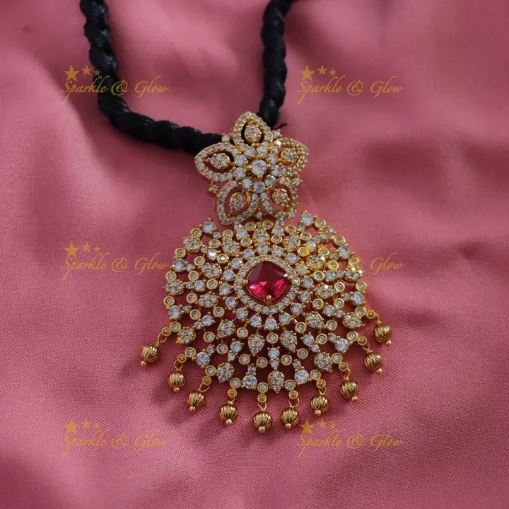 Elegant Floral pendant black thread short necklace with gold beads and ruby - Sparkle and Glow