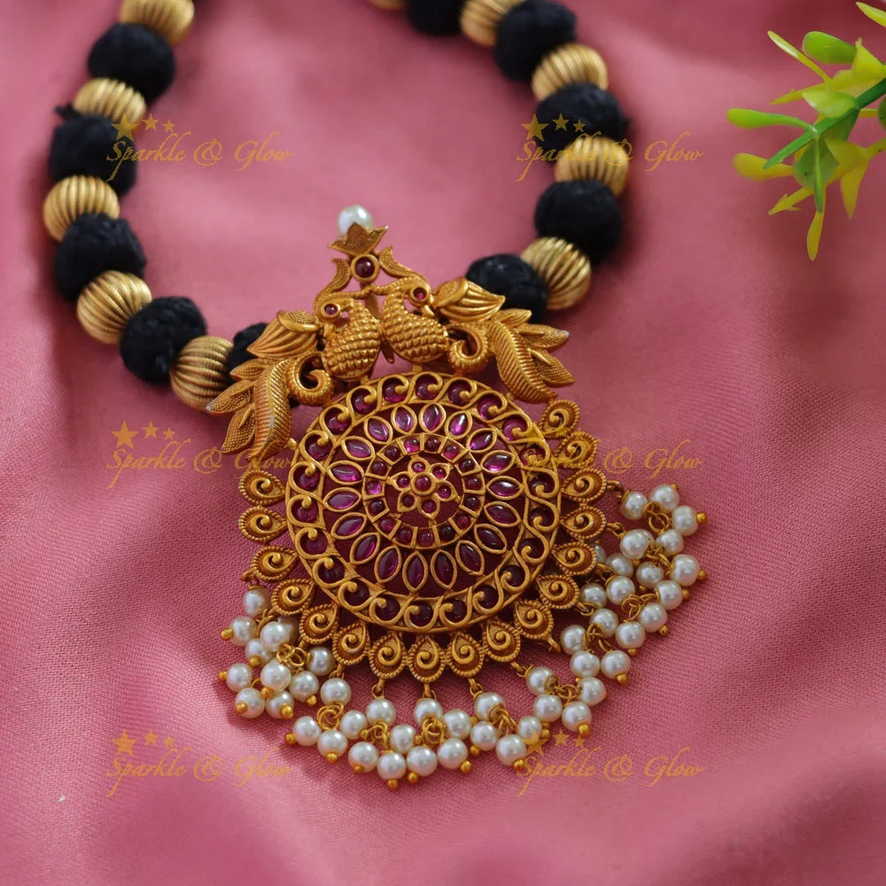 Stunning Peacock floral pendant black thread short necklace with ruby pearls and gold beads - Sparkle and Glow