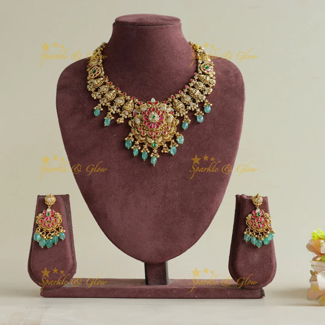 Gorgeous Lakshmi peacock floral jadau short necklace with mint green beads - Sparkle and Glow