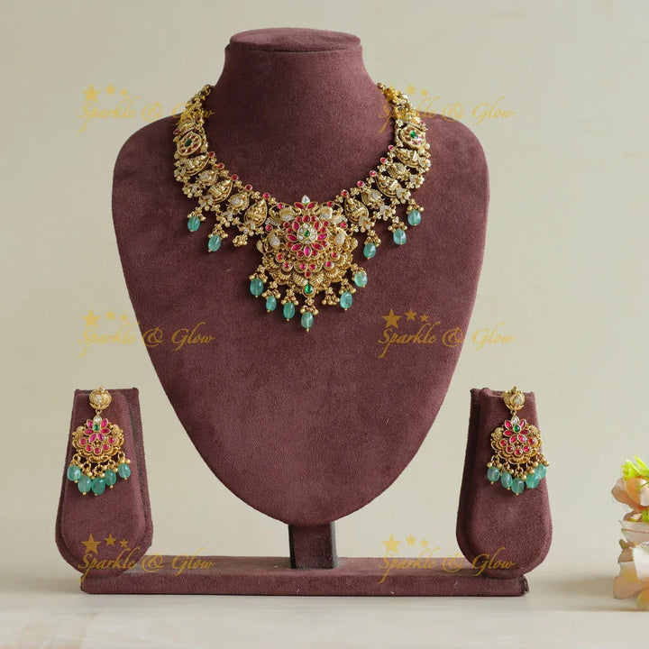 Gorgeous Lakshmi peacock floral jadau short necklace with mint green beads - Sparkle and Glow