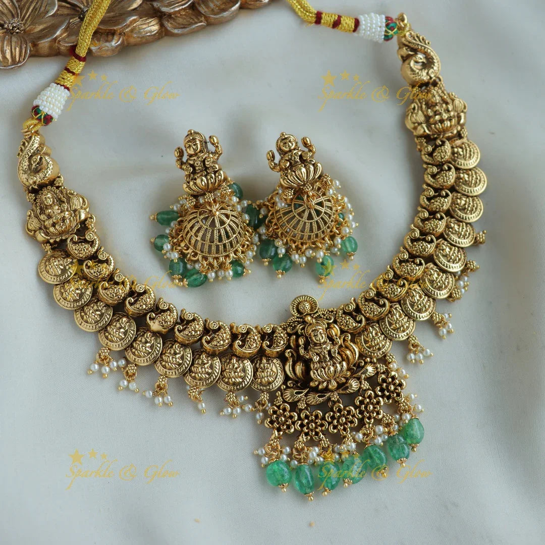 Stunning Lakshmi peacock carved coin short necklace with mint green beads - Sparkle and Glow